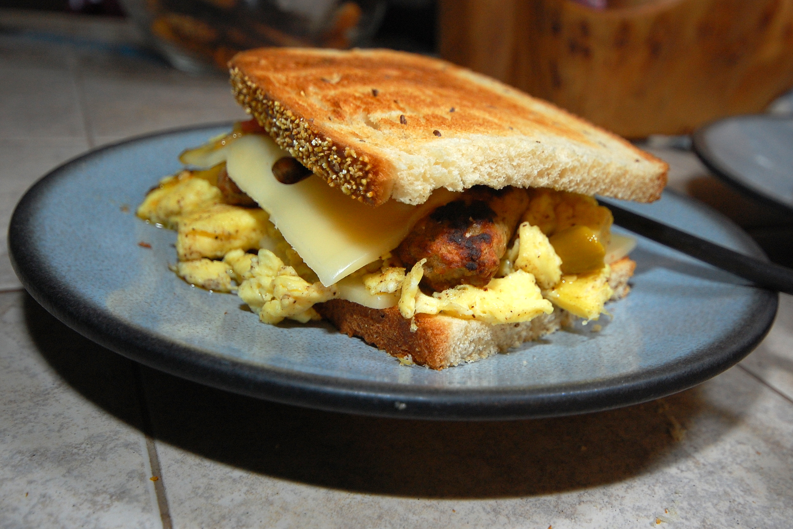 Sausage, scrambled eggs and swiss cheese on rye